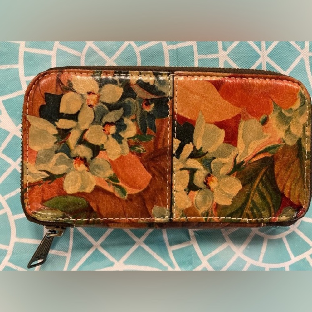 Patricia Nash Italian leather wallet with muted floral design.